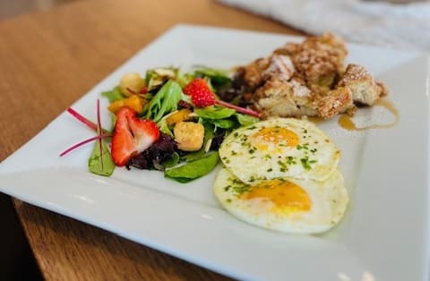 Eggs with breakfast salad and coffee cake